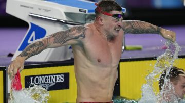 Adam Peaty of England celebrates as he won the Men's 50m Breaststroke Final of the swimming competition at the Commonwealth Games, at the Sandwell Aquatics Centre in Birmingham, England, Tuesday, Aug. 2, 2022. (AP Photo/Kirsty Wigglesworth)