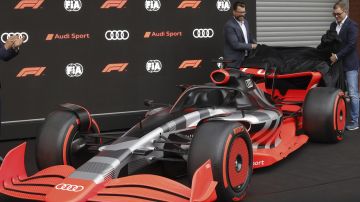 Audi CEO Markus Duesmann, right, and Audi's Chief Development Officer Oliver Hoffman unveil the new Audi F1 car during a media conference ahead of the Formula One Grand Prix at the Spa-Francorchamps racetrack in Spa, Belgium, Friday, Aug. 26, 2022. German manufacturer Audi will enter Formula One in 2026 in line with new engine regulations, chairman Markus Duesmann said on Friday. (AP Photo/Olivier Matthys)