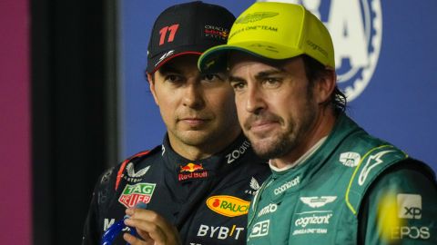 Red Bull driver Sergio Perez of Mexico, left, looks on with Aston Martin driver Fernando Alonso of Spain after the qualifying session ahead of the Formula One Grand Prix at the Jeddah corniche circuit in Jeddah, Saudi Arabia, Saturday, March 18, 2023. Sergio Perez stepped up for Red Bull to ensure the team started from the pole at the Saudi Arabian Grand Prix after a mechanical issue sidelined two-time defending world champion Max Verstappen. (AP Photo/Luca Bruno)