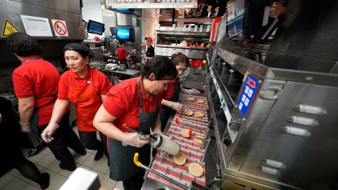 Emloyees of the Rostic's restaurant in Tverskaya street work at a kitchen during the opening ceremony in Moscow, Russia, Tuesday, April 25, 2023. Former KFC restaurants, which were rebranded after the U.S. chain left Russia, opened their doors as Rostic's in Moscow on Tuesday. (AP Photo/Alexander Zemlianichenko)