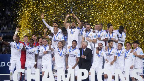 FILE - Real Madrid players celebrate with the trophy after winning the FIFA Club World Cup final match against Al Hilal at Prince Moulay Abdellah stadium in Rabat, Morocco, Saturday, Feb. 11, 2023. The United States will host the Club World Cup in 2025, the first time the FIFA tournament will have 32 teams. Real Madrid, Manchester City and Chelsea already earned places as recent Champions League winners for the expanded tournament lineup that is set to test stadiums and operations one year before the 2026 World Cup. (AP Photo/Manu Fernandez, File)