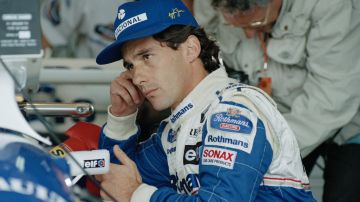 Brazilian Formula One driver Ayrton Senna checks the lap times of his competitors on a computer monitor during practice for the Pacific Grand Prix at the T1 Circuit in Aida, Japan, April 15, 1994. (AP Photo/Hideyuki Yamamoto)