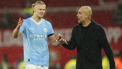 Manchester City's head coach Pep Guardiola talks to Manchester City's Erling Haaland after the English Premier League soccer match between Manchester United and Manchester City at Old Trafford stadium in Manchester, England, Sunday, Oct. 29, 2023. (AP Photo/Dave Thompson)