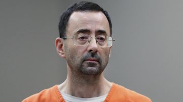 FILE - In this Nov. 22, 2017 file photo, Dr. Larry Nassar, 54, appears in court for a plea hearing in Lansing, Mich. Trustees at Michigan State University agreed Friday to release documents to the state attorney general related to the school's investigations into now-imprisoned former sports doctor Larry Nassar. (AP Photo/Paul Sancya, File)