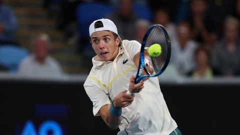 Arthur Cazaux of France plays a backhand return to Holger Rune of Denmark during their second round match at the Australian Open tennis championships at Melbourne Park, Melbourne, Australia, Thursday, Jan. 18, 2024. (AP Photo/Asanka Brendon Ratnayake)