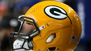 A detailed view of a Green Bay Packers helmet on the sideline against the Dallas Cowboys during an NFL wild-card playoff football game Sunday, Jan. 14, 2024 in Arlington, Texas. (AP Photo/Maria Lysaker)