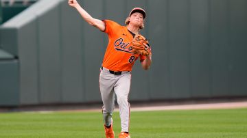 Baltimore Orioles second baseman Jackson Holliday throws to first base on a single by Atlanta Braves David Fletcher in the third inning of a spring training baseball game in North Port, Fla., Friday, March 1, 2024. (AP Photo/Gerald Herbert)