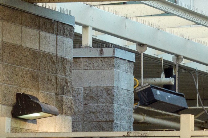 Homeless people await to enter the Midnight Mission late afternoon downtown Los Angeles on Friday, March 22, 2024. (AP Photo/Damian Dovarganes)