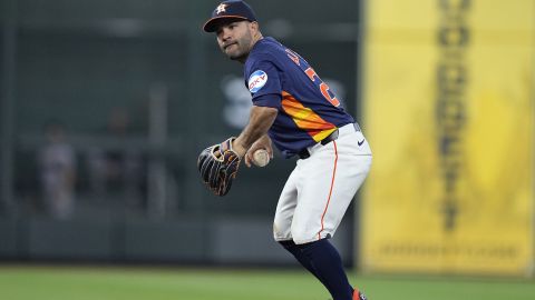 Houston Astros second baseman Jose Altuve fields a ground ball out from New York Yankees designated hitter Giancarlo Stanton during the sixth inning of a baseball game, Sunday, March 31, 2024, in Houston. (AP Photo/Kevin M. Cox)