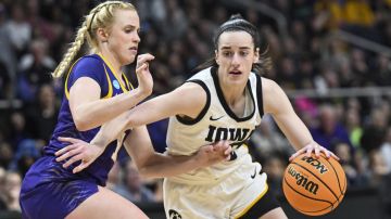 Iowa guard Caitlin Clark (22) is defended by LSU guard Hailey Van Lith (11) during the second half of a Elite Eight college basketball game in the NCAA Tournament, Monday, April 1, 2024, in Albany, N.Y. (AP Photo/Hans Pennink)
