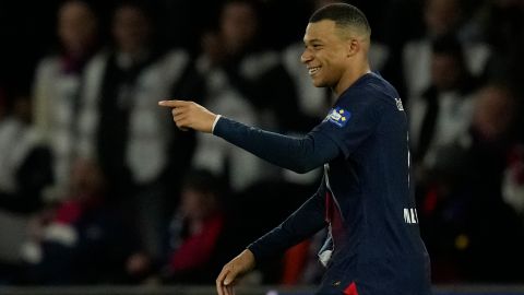 PSG's Kylian Mbappe celebrates after scoring his side's opening goal during the French Cup semifinal soccer match between Paris Saint-Germain and Rennes at the Parc des Princes stadium in Paris, France, Wednesday, April 3, 2024. (AP Photo/Thibault Camus)