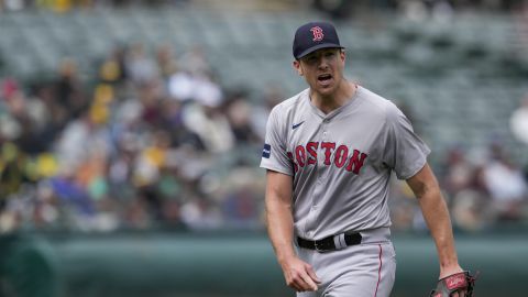 Boston Red Sox pitcher Nick Pivetta reacts after second baseman Enmanuel Valdez turned a double play with the bases loaded against the Oakland Athletics to end the fifth inning of a baseball game Wednesday, April 3, 2024, in Oakland, Calif. (AP Photo/Godofredo A. Vásquez)