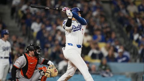 Los Angeles Dodgers designated hitter Shohei Ohtani hits a home run during the seventh inning of a baseball game against the San Francisco Giants in Los Angeles, Wednesday, April 3, 2024. (AP Photo/Ashley Landis)