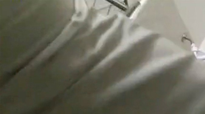 In this image from San Bernardino County Sheriff's Department body camera video, deputies confront a teen in a bathroom in Victorville, Calif., Tuesday, April 2, 2024. Authorities say sheriff's deputies shot and killed the 17-year-old boy with mental health issues after he armed himself with a knife and locked himself inside a bathroom at a home. San Bernardino County Sheriff Shannon Dicus says the teen was being transferred from a hospital, where he had been treated after cutting himself, to a mental health facility when he escaped on Tuesday. (San Bernardino County Sheriff's Dept. via AP)