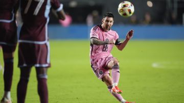 Inter Miami forward Lionel Messi, right, takes an unsuccessful free kick against the Colorado Rapids during the second half of an MLS soccer match, Saturday, April 6, 2024, in Fort Lauderdale, Fla. (AP Photo/Rebecca Blackwell)