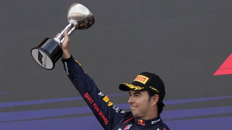 Second placed Red Bull driver Sergio Perez celebrates on the podium after the Japanese Formula One Grand Prix at the Suzuka Circuit in Suzuka, central Japan, Sunday, April 7, 2024. (AP Photo/Hiro Komae)