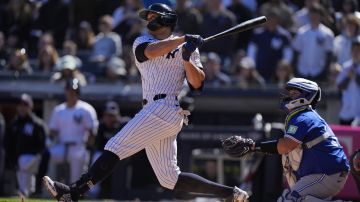 New York Yankees' Giancarlo Stanton watches a ball he hit for a grand slam during the third inning of a baseball game against the Toronto Blue Jays Sunday, April 7, 2024, in New York. (AP Photo/Frank Franklin II)