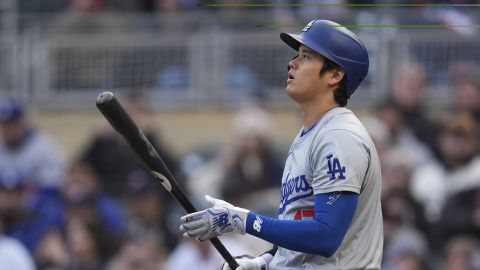 Los Angeles Dodgers designated hitter Shohei Ohtani stands at the plate while batting during the first inning of a baseball game against the Minnesota Twins, Monday, April 8, 2024, in Minneapolis. (AP Photo/Abbie Parr)