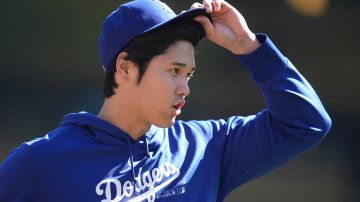 Los Angeles Dodgers' Shohei Ohtani stands on the field before a baseball game against the Minnesota Twins, Wednesday, April 10, 2024, in Minneapolis. (AP Photo/Abbie Parr)