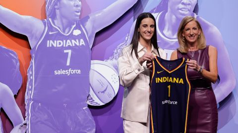 CORRECTS TO CAITLIN CLARK NOT CAITLYN CLARK - Iowa's Caitlin Clark, left, poses for a photo with WNBA commissioner Cathy Engelbert, right, after being selected first overall by the Indiana Fever during the first round of the WNBA basketball draft, Monday, April 15, 2024, in New York. (AP Photo/Adam Hunger)