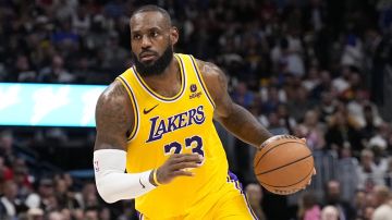 Los Angeles Lakers forward LeBron James brings the ball upcourt against the Denver Nuggets during the second half in Game 2 of an NBA basketball first-round playoff series Monday, April 22, 2024, in Denver. (AP Photo/Jack Dempsey)