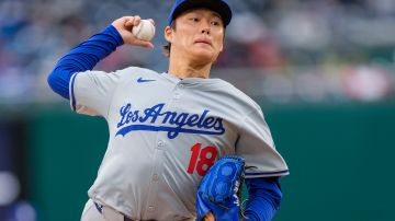Los Angeles Dodgers pitcher Yoshinobu Yamamoto throws during the third inning of a baseball game against the Washington Nationals at Nationals Park, Thursday, April 25, 2024, in Washington. (AP Photo/Alex Brandon)