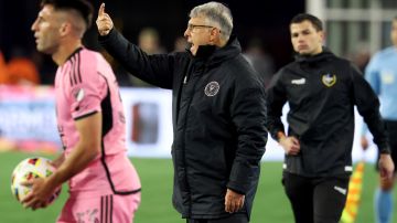 Inter Miami coach Gerardo Martino, center, yells calls from the sideline in the second half of an MLS soccer match against the New England Revolution, Saturday, April 27, 2024, in Foxborough, Mass. (AP Photo/Mark Stockwell)