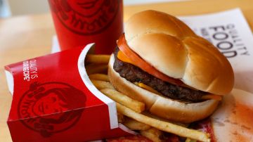 This is a Wendy's single hamburger with cheese combo meal at a Wendy's restaurant in Pittsburgh, Monday, March 17, 2014. (AP Photo/Gene J. Puskar)