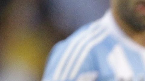 FILE - The July 3, 2010 file photo shows Argentina's Lionel Messi, right, and Germany's Mesut Ozil during the World Cup quarterfinal soccer match between Argentina and Germany at the Green Point stadium in Cape Town, South Africa. On Sunday, July 13, 2014, Germany and Argentina will face each other again in the final of the 2014 soccer World Cup. (AP Photo/Matt Dunham, file)