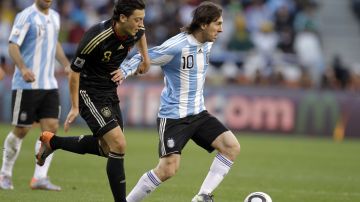 FILE - The July 3, 2010 file photo shows Argentina's Lionel Messi, right, and Germany's Mesut Ozil during the World Cup quarterfinal soccer match between Argentina and Germany at the Green Point stadium in Cape Town, South Africa. On Sunday, July 13, 2014, Germany and Argentina will face each other again in the final of the 2014 soccer World Cup. (AP Photo/Matt Dunham, file)
