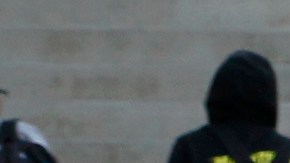 Students arrive at the Ramon C. Cortines School of Visual and Performing Arts in downtown Los Angeles on Wednesday, Dec. 16, 2015. Students are heading back to class a day after an emailed threat triggered a shutdown of the vast Los Angeles Unified School District. (AP Photo/Nick Ut)