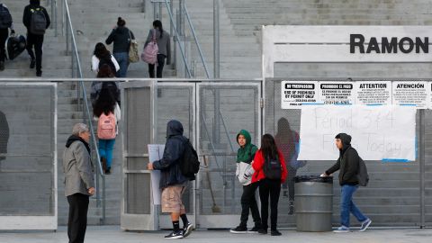 Students arrive at the Ramon C. Cortines School of Visual and Performing Arts in downtown Los Angeles on Wednesday, Dec. 16, 2015. Students are heading back to class a day after an emailed threat triggered a shutdown of the vast Los Angeles Unified School District. (AP Photo/Nick Ut)