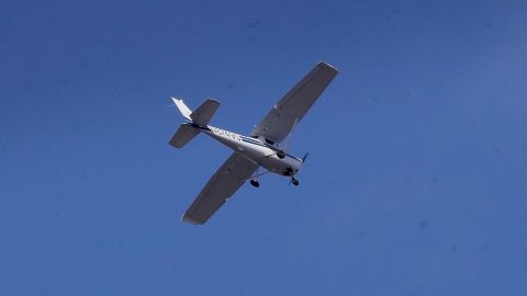 A security plane flies near the finish line of the 121st Boston Marathon on Monday, April 17, 2017, in Boston. (AP Photo/Charles Krupa)