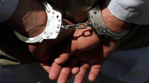 One of five alleged suicide bomber is handcuffed as they are shown to the media at the Afghan National Police crisis unit's headquarters in Kabul, Afghanistan on Thursday, April 8, 2010. Afghan police arrested the five would-be suicide bombers Thursday in Kabul _ the largest suicide bomb team ever apprehended in the capital, officials said. (AP Photo/Musadeq Sadeq)