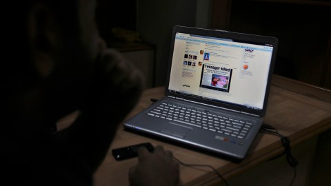 A Kashmiri youth reads a news item posted on his Facebook page in an Internet cafe in Srinagar, India, Friday, Aug. 27, 2010. With student discussion groups banned and thousands of security operatives believed to be snooping on protesters, a wave of Web-savvy protesters in Indian-controlled Kashmir have begun using social networking to publicize their fight and keep fellow demonstrators energized and focused. The protesters who call themselves "sangbazan," or the stone pelters, use Facebook to debate the weekly calendar of protests, discuss ways to hold Kashmiri leaders accountable and trade daily news updates, some of questionable reliability. (AP Photo/Altaf Qadri)