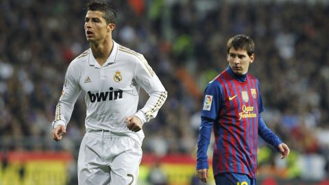 Real Madrid's Cristiano Ronaldo from Portugal, left, runs beside FC Barcelona's Lionel Messi from Argentina, right, during their quarter finals, first leg, Copa del Rey soccer match at the Santiago Bernabeu stadium in Madrid, Spain, Wednesday, Jan. 18, 2012. (AP Photo/Andres Kudacki)