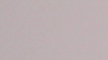 A Bahrain anti-government protester aims his slingshot toward riot police Friday, March 30, 2012, in Sitra, Bahrain, where widespread demonstrations remembering those who've died in the past year's unrest were broken up by police firing tear gas and clashes erupted. Amnesty International on Friday urged Bahrain to free a leading human rights activist who is on a hunger strike and reminded the Gulf kingdom's rulers to fulfill promises to release all those jailed for speaking out during the country's uprising. (AP Photo/Hasan Jamali)