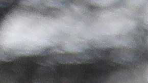 A San Jose Fire Dept. firefighter monitors a overflowing creek as rescues are underway Tuesday, Feb. 21, 2017, in San Jose, Calif. Rescuers chest-deep in water steered boats carrying dozens of people, some with babies and pets, from a San Jose neighborhood inundated by water from an overflowing creek Tuesday. (AP Photo/Marcio Jose Sanchez)