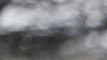 A San Jose Fire Dept. firefighter monitors a overflowing creek as rescues are underway Tuesday, Feb. 21, 2017, in San Jose, Calif. Rescuers chest-deep in water steered boats carrying dozens of people, some with babies and pets, from a San Jose neighborhood inundated by water from an overflowing creek Tuesday. (AP Photo/Marcio Jose Sanchez)