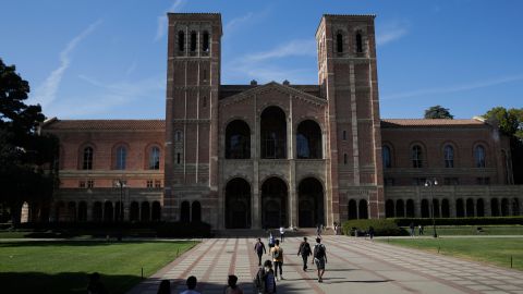 Students walk past Royce Hall at the University of California, Los Angeles Thursday, April 25, 2019, in the Westwood section of Los Angeles. Hundreds of students and staff at two Los Angeles universities, including UCLA, have been placed under quarantine because they may have been exposed to measles. Officials say the people affected by the order either have not been vaccinated or cannot verify that they are immune. (AP Photo/Jae C. Hong)