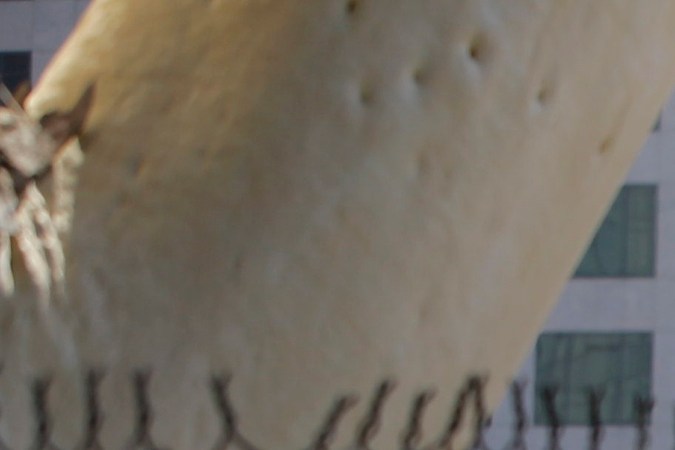 A newly displaced homeless camp is seen while Los Angeles Police officers guard a Harbor Freeway ramp during the visit of President Donald Trump in Los Angeles, Tuesday, Sept. 17, 2019. Trump began a California visit on Tuesday, saying he will do "something" about homelessness but offering no specifics beyond the mention of creating a task force. (AP Photo/Damian Dovarganes)