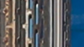 FILE - In this Aug. 15, 2019, file photo, a Pacific Gas & Electric worker walks in front of a truck in San Francisco. Two years to the day after some of the deadliest wildfires tore through Northern California wine country, two of the state's largest utilities were poised Tuesday, Oct. 8, 2019, to shut off power to more than 700,000 customers in 37 counties, in what would be the largest preventive shut-off to date as utilities try to head off wildfires caused by faulty power lines. (AP Photo/Jeff Chiu, File)