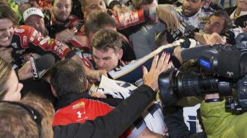 Jeff Gordon is in the middle of a fight after the NASCAR Sprint Cup Series auto race at Texas Motor Speedway in Fort Worth, Texas, Sunday, Nov. 2, 2014. The crews of Gordon and Brad Keselowski fought after the race. (AP Photo/Matthew Bishop)