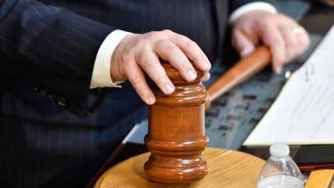 The hands of Kentucky Senate President David Stivers sit on his gavel during the final day of the session for the Kentucky Legislature at the Kentucky State Capitol in Frankfort, Ky., Tuesday, March 30, 2021. (AP Photo/Timothy D. Easley)