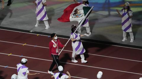 The flag of Mexico is carried into the stadium during the closing ceremony for the 2020 Paralympics at the National Stadium in Tokyo, Sunday, Sept. 5, 2021. (AP Photo/Eugene Hoshiko)