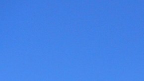 FILE - This March 12, 2019, file photo shows the University Village area of the University of Southern California, in Los Angeles. The first trial in the "Operation Varsity Blues" college admissions bribery scandal will begin this week, Wednesday, Sept. 8, 2021, with the potential to shed light on investigators' tactics and brighten the spotlight on a secretive school selection process many have long complained is rigged to favor the rich. (AP Photo/Reed Saxon, File)