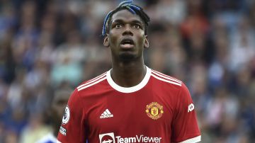 FILE - Manchester United's Paul Pogba looks up during the English Premier League soccer match between Leicester City and Manchester United at King Power stadium in Leicester, England, Saturday, Oct. 16, 2021. French prosecutors are investigating allegations that World Cup winner Paul Pogba was targeted by extortion attempts by his brother and childhood friends. The Paris prosecutor's office said Monday Aug. 29, 2022 it opened an investigation earlier this month into attempted organized extortion, which is being handled by anti-corruption police. (AP Photo/Rui Vieira, File)