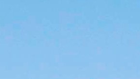 FILE - In this Oct. 25, 2013, file photo, a plastic bag sits along a roadside in Sacramento, Calif. California in 2014 enacted the nation's first ban on single-use plastic shopping bags. But in 2022, state Attorney General Rob Bonta says consumers who think they're helping the environment with reusable plastic bags had better think again. He says manufacturers can't back up their claim that the thicker, more durable bags are recyclable in California. (AP Photo/Rich Pedroncelli, File)