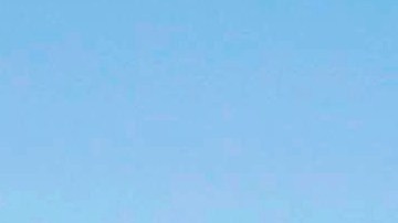 FILE - In this Oct. 25, 2013, file photo, a plastic bag sits along a roadside in Sacramento, Calif. California in 2014 enacted the nation's first ban on single-use plastic shopping bags. But in 2022, state Attorney General Rob Bonta says consumers who think they're helping the environment with reusable plastic bags had better think again. He says manufacturers can't back up their claim that the thicker, more durable bags are recyclable in California. (AP Photo/Rich Pedroncelli, File)