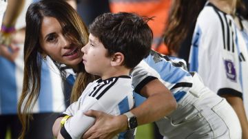 Antonela Roccuzzo, wife of Lionel Messi, embraces their son Mateo prior to an international friendly soccer match between Argentina and Panama in Buenos Aires, Argentina, Thursday, March 23, 2023. (AP Photo/Gustavo Garello)
